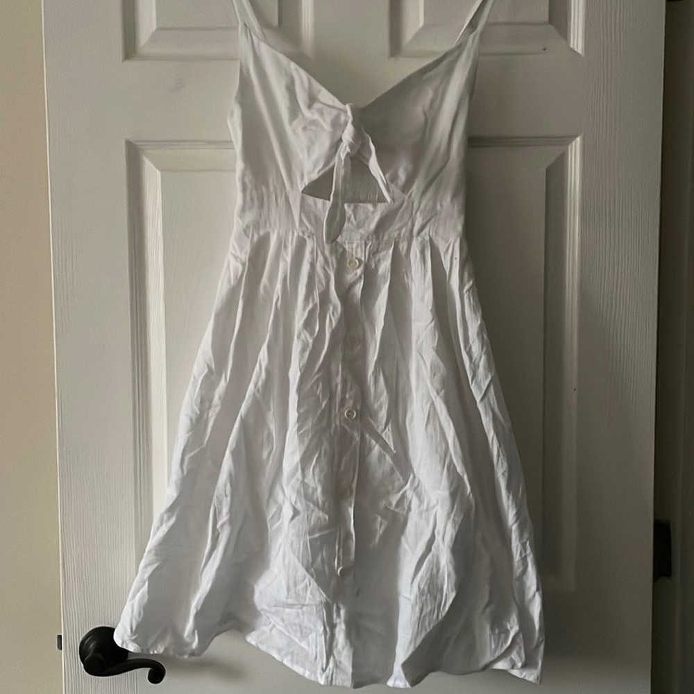 White dress with buttons down the middle